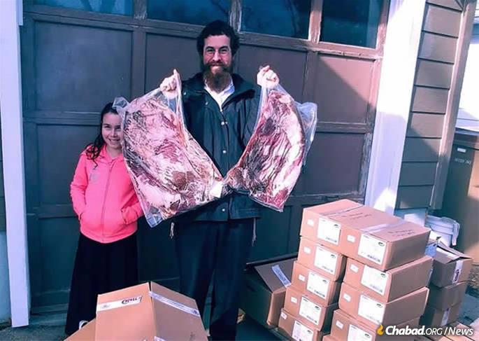 Rabbi Avrohom Simmonds and family in Regina, Saskatchewan, Canada, happily receives their shipment of kosher beef.