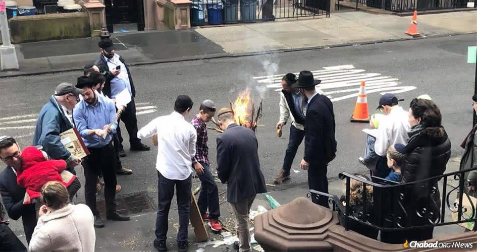 Burning the chametz last year with Chabad of Brooklyn Heights.