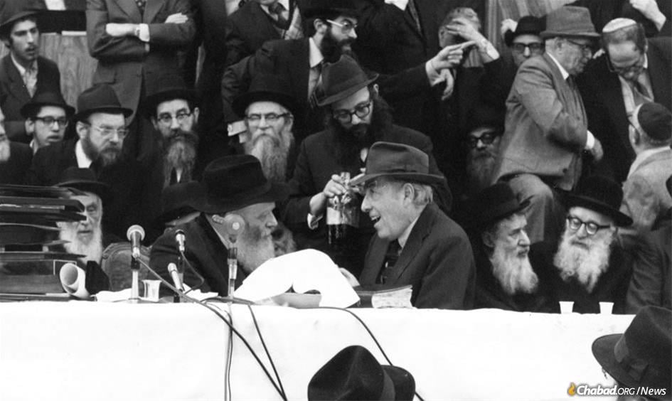 Herman Wouk drew deeply from his intense, decades-long relationship with the Rebbe, Rabbi Menachem M. Schneerson, of righteous memory, shown together here at a Chassidic gathering in 1972. (Photo: JEM)