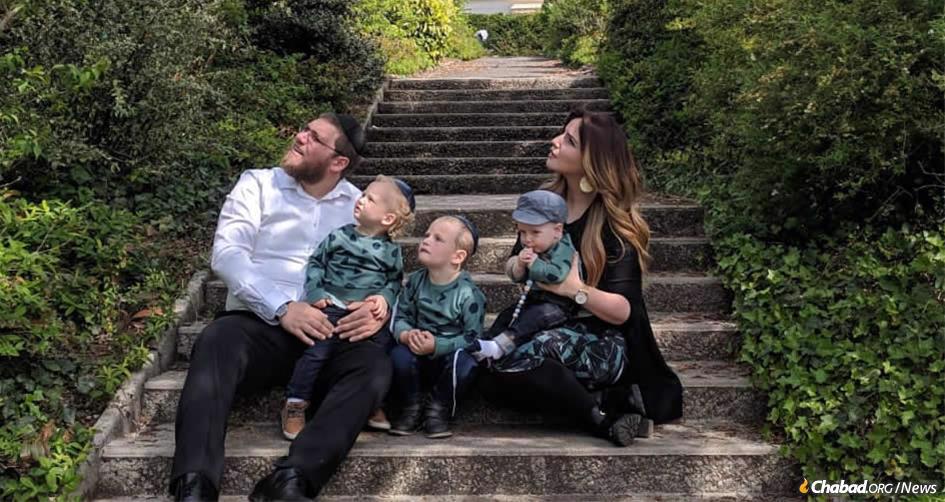 Rabbi Mordechai and Zlata Lewin, and their children, watch a military flyover in Normandy, France, site of the decisive Allied landing on D-Day that turned the tide of World War II.