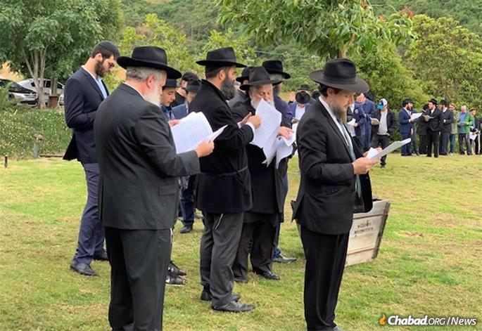 Rabbis and community members gather for the consecration of a new Jewish cemetery area in San Diego.