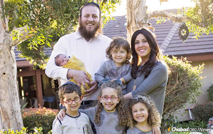 Rabbi Rafi and Chaya Andrusier, co-directors of Chabad of East County in San Diego, with their children