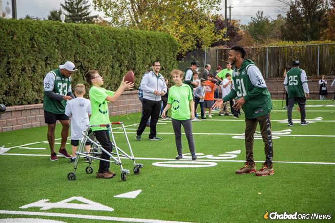 Playing on the NFL/New York Jets-sponsored flag-football field at LifeTown. (Photo: Mendel Grossbaum)