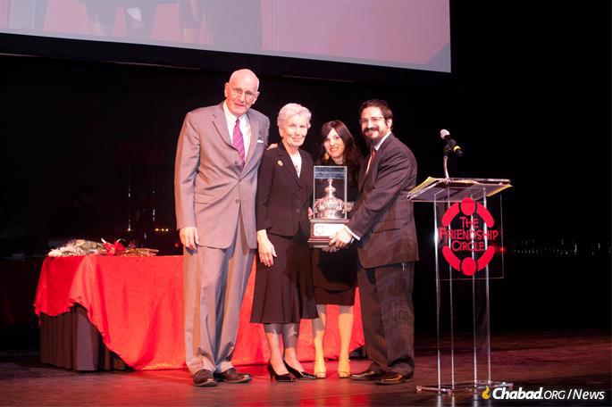 Philanthropists Jerry and Paula Gottesman were honored at a Friendship Circle dinner in 2011 by Rabbi Zalman amd Toba Grossbaum.