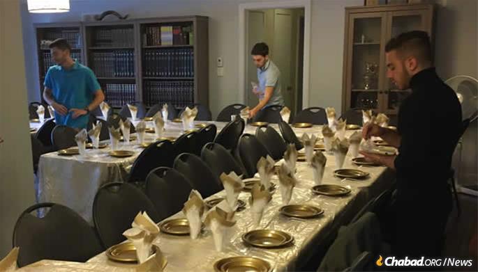 Chabad Houses around the world are readying for services and setting their tables, like this one is Guelph, Ontario, to share a festive meal with local residents and travelers on the holiday.