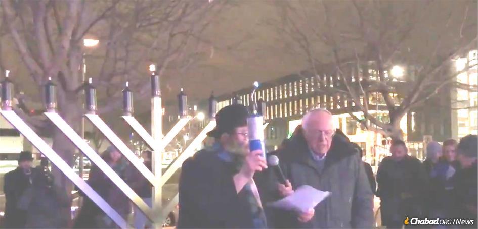 Rabbi Yossi Jacobson, who co-directs Chabad-Lubavitch of Iowa, with Vermont Sen. Bernie Sanders, who lit a large public menorah at Chabad-Lubavitch of Iowa’s Chanukah celebration.