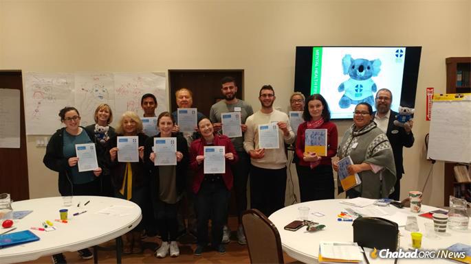Participants in the Mental Health First Aid class in Houston display their certificates.
