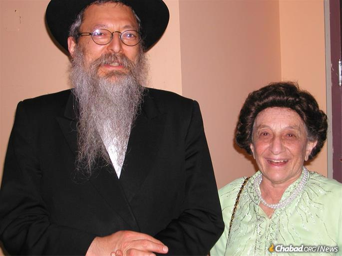 With her eldest son, Rabbi Avraham Altein.