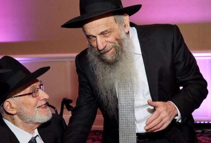 Rabbi Yitzchak Warman, left (Photo: Tsemach Glen/Hamodia)