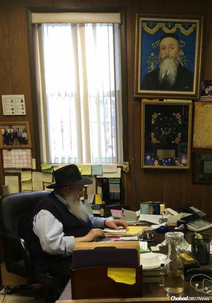 Rubashkin began working in Samarkand, Soviet Uzbekistan, around 1945, going through the daily grind (except for Shabbat and Jewish holidays) until his recent illness. He is pictured in his Borough Park office with the portrait of the Kopizhnitzer Rebbe, for whose kindness he was forever grateful, above his desk.