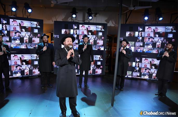 Standing apart from each other, as per protocol, the acapella singers accompanied Cantor Berel Zucker in singing Chabad melodies (Photo: Itzik Roytman).