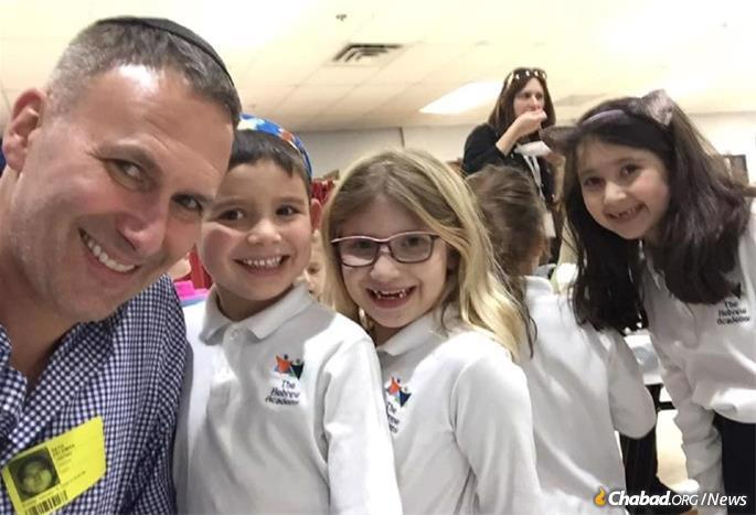 One brief enounter with a Jewish message can touch a person's heart and have an impact on generations. Here Feldman joins his daugher and her friends at a school party at the Hebrew Academy in Marlboro, N.J.