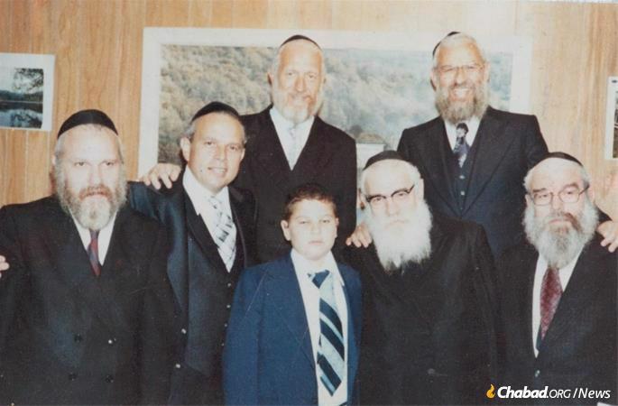 Rabbi Sholom Hecht, second from left, with his brothers, from left: Rabbi Peretz Hecht, Rabbi JJ Hecht, Rabbi Shlomo Zalman Hecht, Rabbi Avrohom Hecht and Rabbi Moshe Yitzchak Hecht.
