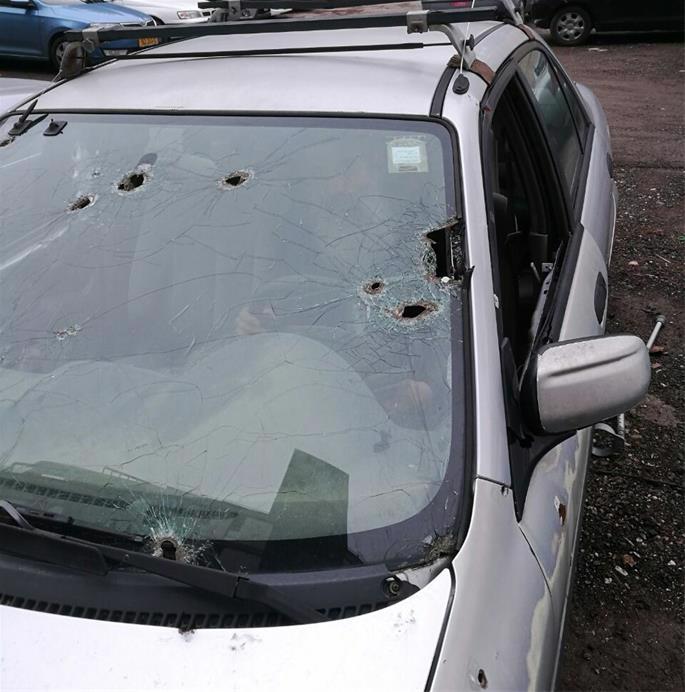 The bullet-ridden car that the Nirs were driving on that fateful Chanukah night.