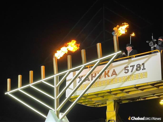 Chief Rabbi of Russia Berel Lazar lights the menorah in Moscow.