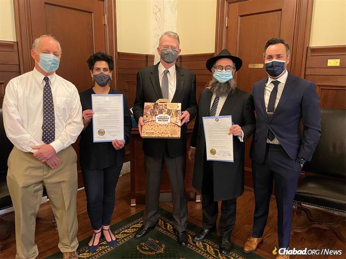Idaho Gov. Brad Little (center) poses with Rabbi Mendel Lifshitz (second from right) who directs Chabad of Idaho, as well as several local community members at the signing ceremony of the State of Idaho's Education and Sharing Day Proclamation on March 24, 2021. (Credit: Dan Berger)