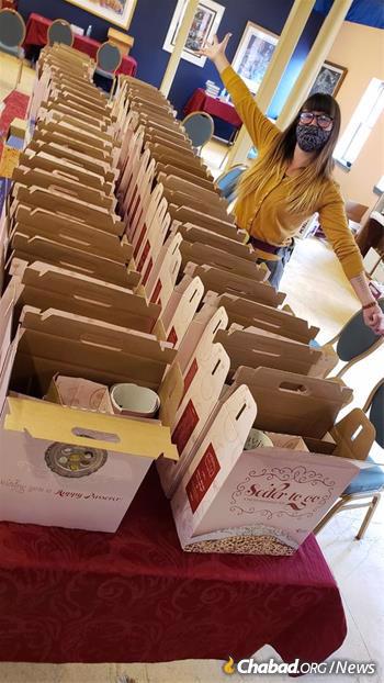 Volunteer Liv Orovitch helps pack and distribute “Seder-to-Go” kits this year at Chabad of Santa Fe, N.M. (Credit: Chabad of Santa Fe)