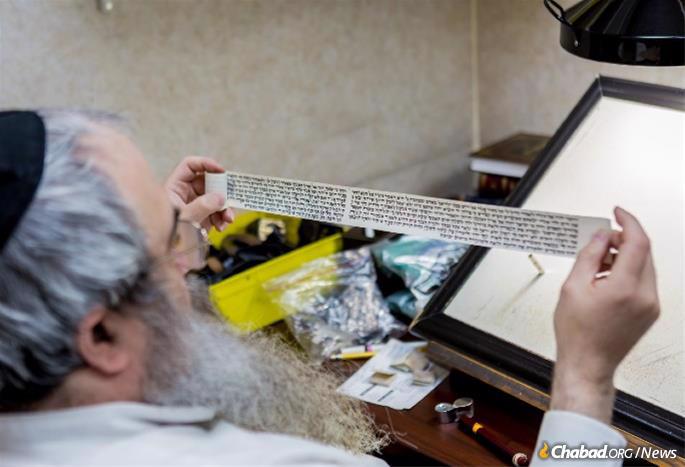 An important action to take during the Hebrew month of Elul is to have mezuzahs and tefillin checked by a certified, experienced sofer (scribe). (Photo: Eliyahu Parypa/Chabad.org)