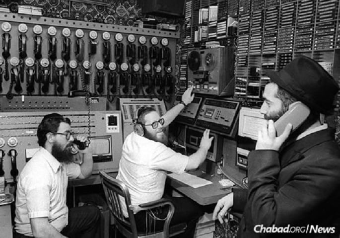 From left: Rabbis Chaim Boruch Halberstam, Yosef Yitzchak (Y.Y.) Kazen and Yonasan Hackner at work in WLCC, Nov. 27, 1980 (&#169; JEM/The Living Archive)