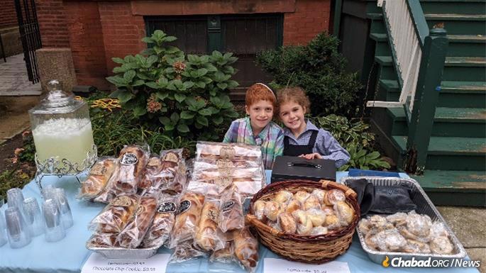 Mendel (7) and Mussie (5) Kotlarsky run a lemonade and challah stand outside their parents&#39; Chabad center in Chicago. &quot;It&#39;s truly a special stand,&quot; says their mother, Devorah Leah Kotlarsky, &quot;we meet many people each Friday, offering Shabbat candles and an opportunity to put on tefillin.&quot;
