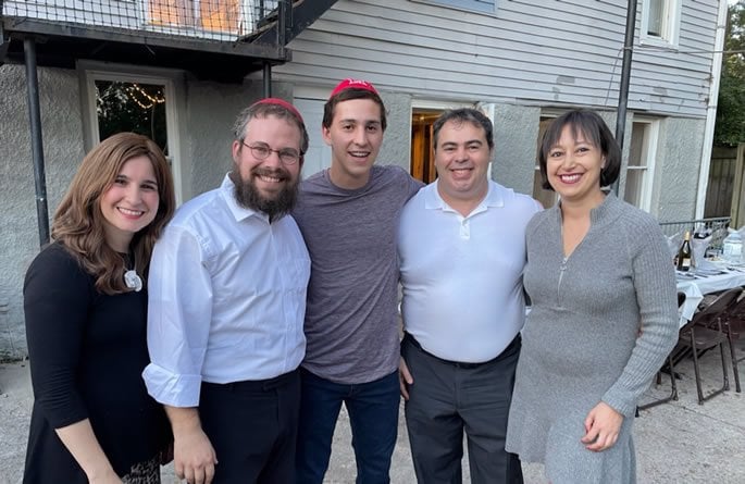 Rabbi Yossi and Mushka Greenberg with Alan and his parents.