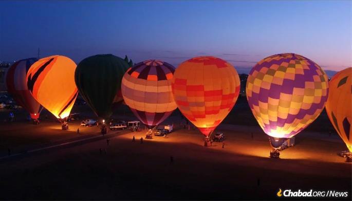 Looming 70 feet up, Chabad of New Mexico will fire up nine hot air balloons on the eighth day of Chanukah.