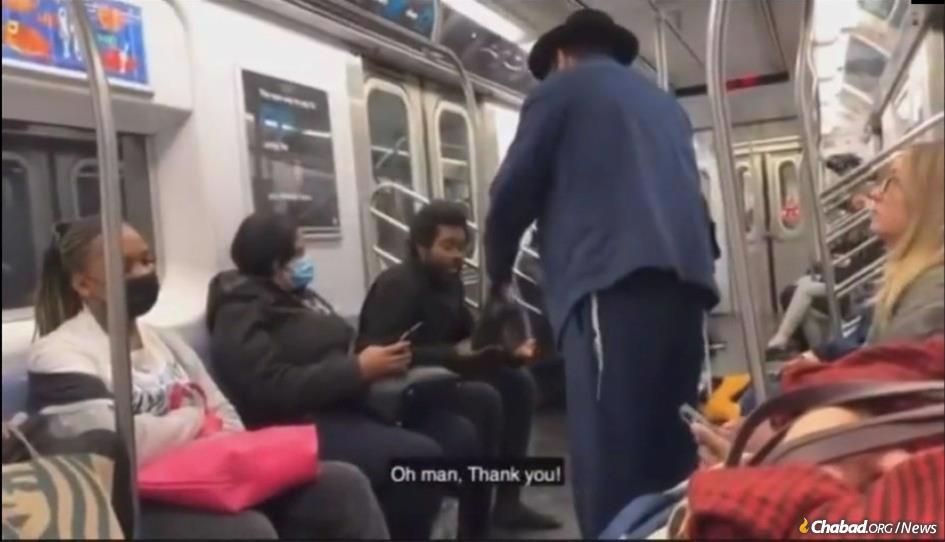 Rabbi Gabriel Benayon took off his own shoes, rose from his seat and handed them to the barefoot stranger. The subway car broke out in applause.