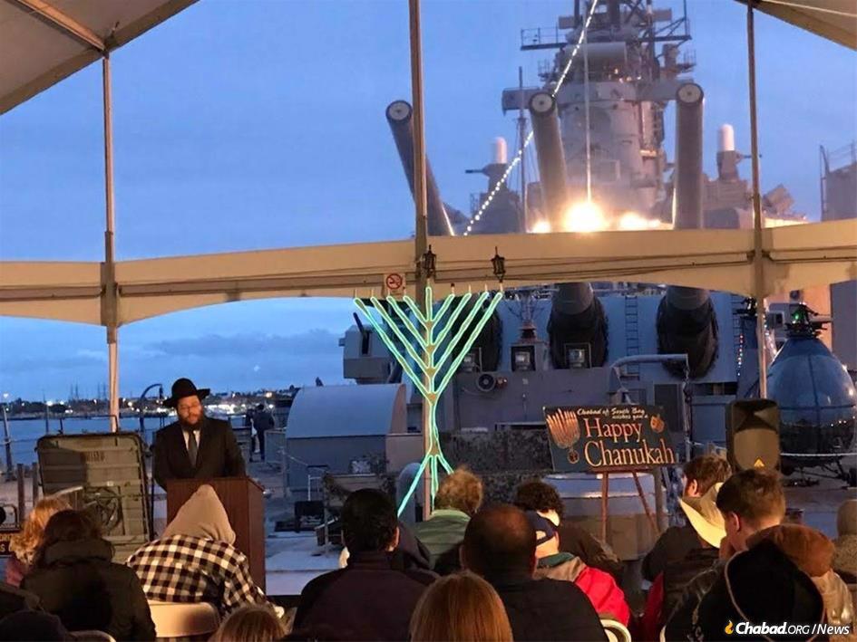 Rabbi Sholom Pinson at the menorah-lighting aboard the “USS Iowa” in the community of San Pedro in Los Angeles.