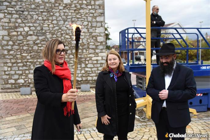 Head of the E.U. Delegation to Montenegro Oana Cristina Popa, who was honored with lighting the shamash. The event was broadcast on national television..