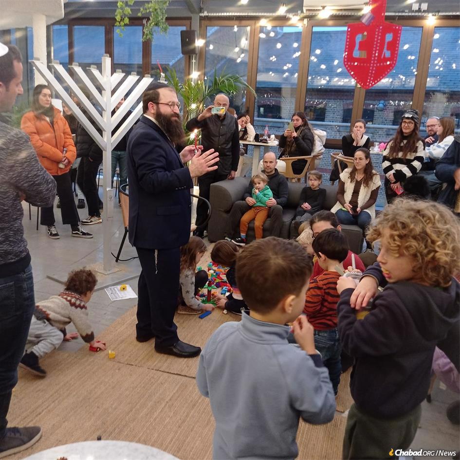 Rabbi Yossi and Rivky Baitz hosted a Chanukah party and menorah-lighting in Camden Town, London, England.
