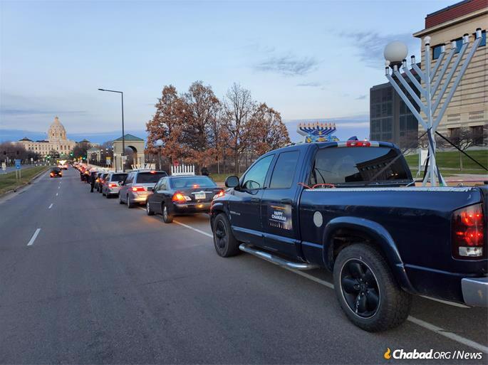 A car-menorah parade heads towards the Minnesota State Capitol in St. Paul.