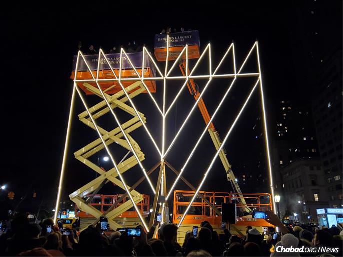 The Yaacov Agam-designed menorah stands 32-feet tall at its branches, the tallest allowed according to Jewish law for a kosher menorah, with the shamash helper candle topping out at 36 feet.