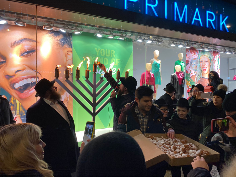 Lighting the menorah on Oxford Street in London, where an antisemitic attack on Jewish celebrants occurred on the second night of the holiday.