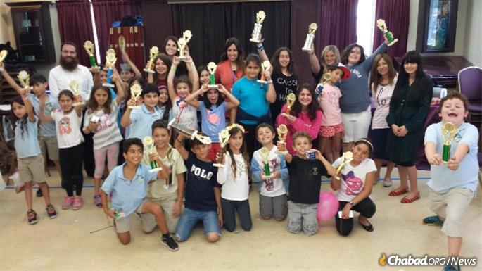 Children are awarded trophies for excelling at the Chabad-created Aleph Champ curriculum.