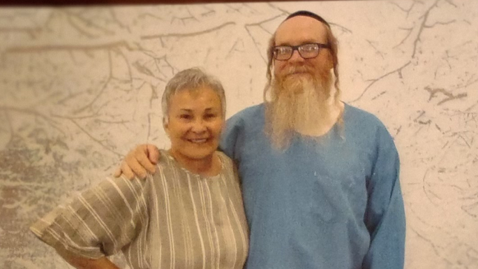 Pinchas in his prison uniform during a visit with his mother.