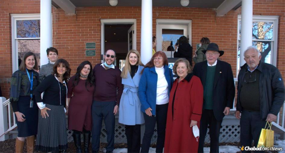 Elected officials and community leaders at the Auroria Campus in Denver join Aura and Rabbi Yisrael Moshe Ort (4th from left and center) at the rededication of the Golda Meir House Museum.