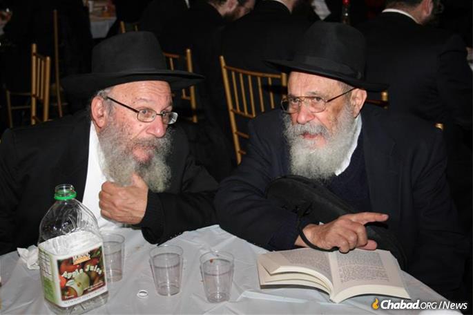 With his older brother Rabbi Zalman Posner.
