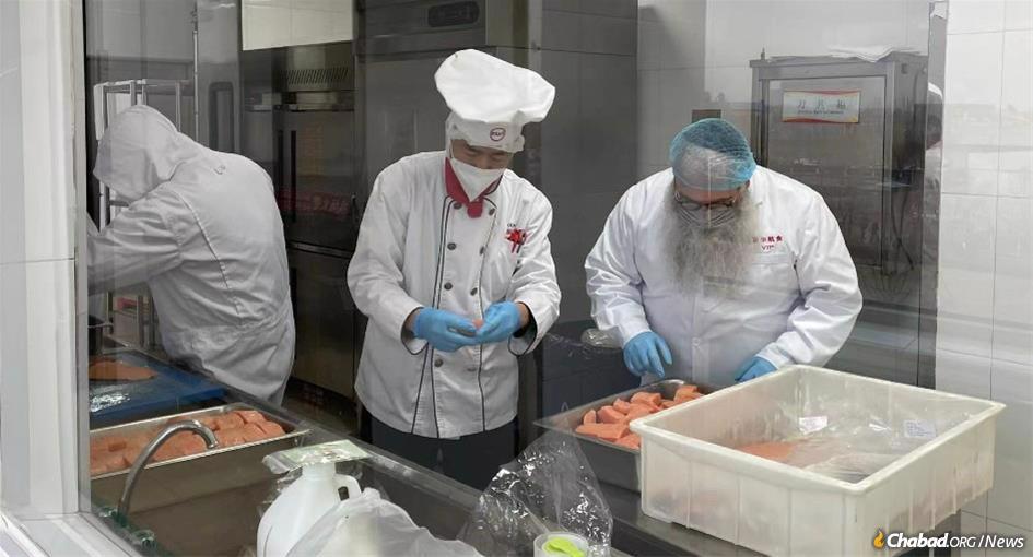 In Beijing, Rabbi Shimon Freundlich, right, supervises the preparation of kosher meals for Jewish athletes, coaches and journalists at the Olympics.