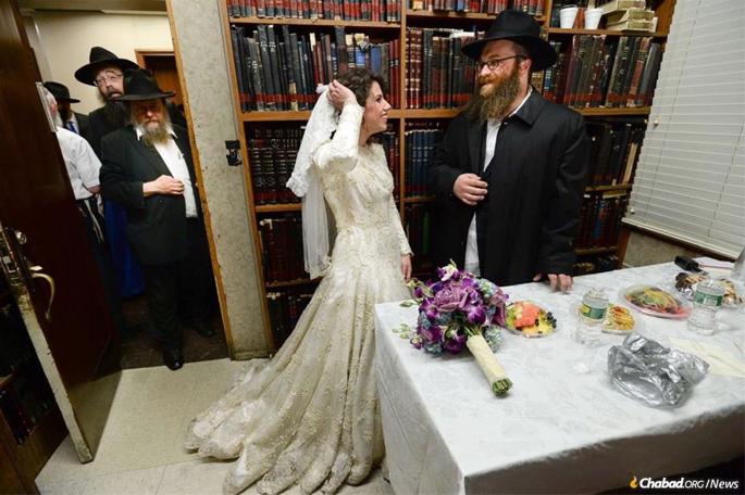 Tzvi and Esther Ita Holt after their wedding at 770 Eastern Parkway in Brooklyn.