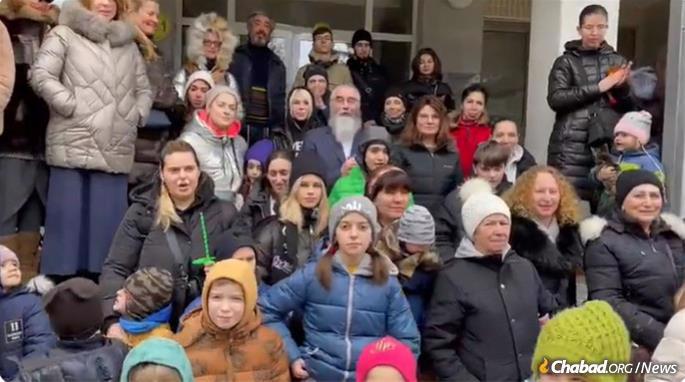 A group of refugees from Ukraine expressed their thanks in Moldova en route to Germany.