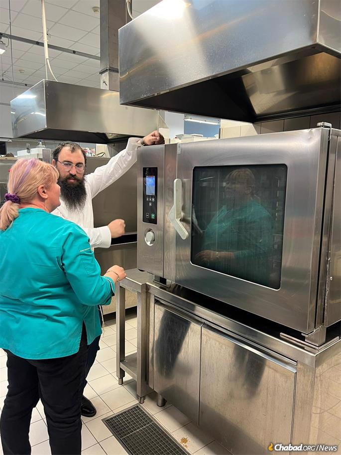 Rabbi Dovber Orgad kashers the hotel's kitchen in anticipation of the Jewish refugees' arrival.