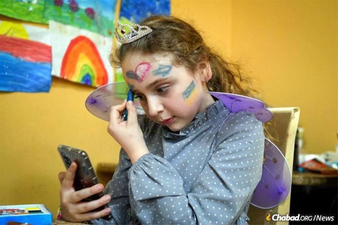 A Jewish girl dresses up for Purim in a refugee camp in Moldava. (Credit: Flash90)