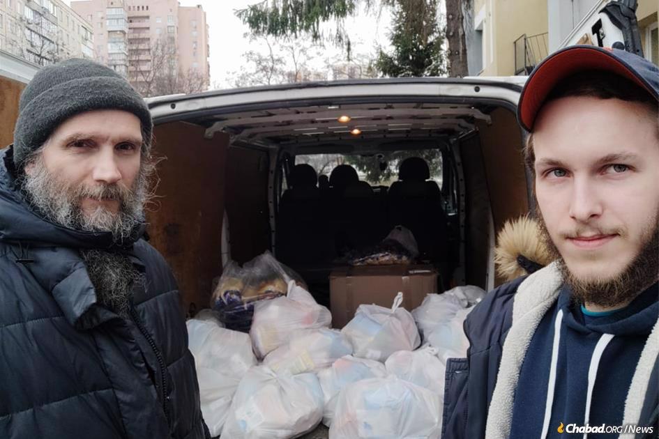 Daniel, right, a 21-year-old staffer at the Chabad Jewish community in Eastern Kiev who has been helping Jews in Kiev night and day.