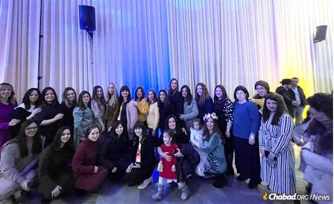 An informal gathering of Chabad-Lubavitch women emissaries, many from Ukraine, at a Purim party for Ukrainian refugees in Kfar Chabad, Israel.