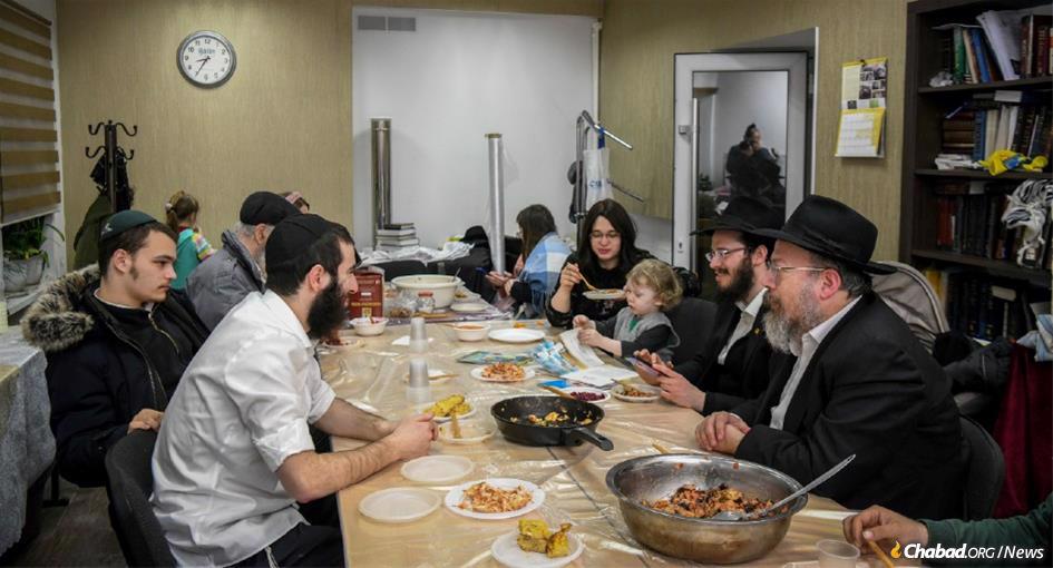 Tens of thousands of Jewish refugees from Ukraine are expected to participate in Passover Seders at Chabad centers large and small throughout Europe. At the,Chabad house in Chisinau, Moldava, above, Rabbi Zusha Abelsky hosted refugees earlier this month. (Photo by Yossi Zeliger/Flash90)