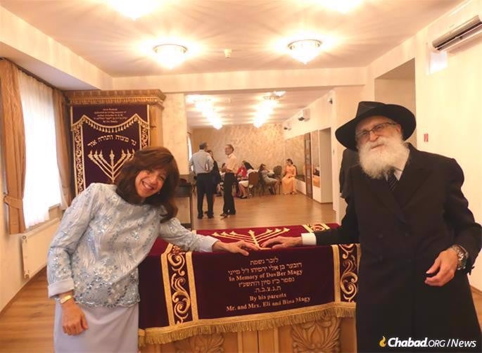 Chanie Myers with her father, Eli Magy, in 2019 at the dedication of the first sefer Torah to be written in Slovakia since the Holocaust.