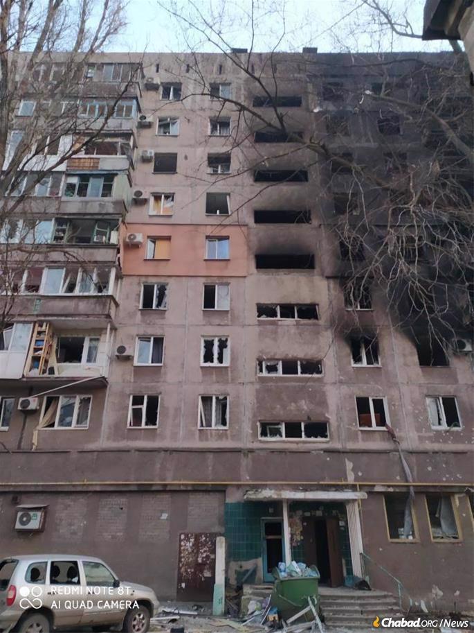 A neighboring apartment building in Mariupol. Survivors joined Lyudmila and her family in their nearby basement shelter. (Photo: Courtesy)
