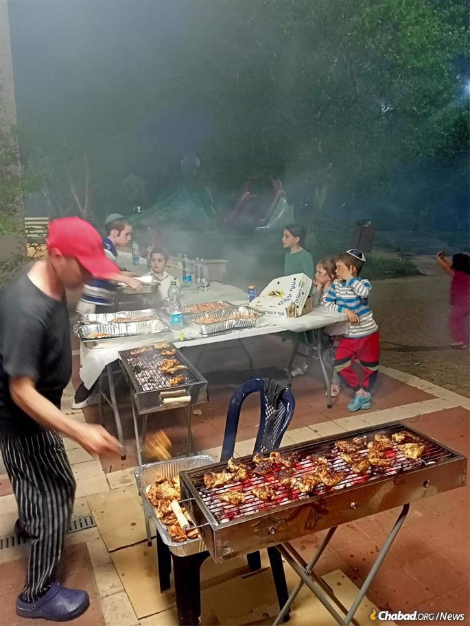 Kids from Ukraine enjoy a barbeque in Safed.