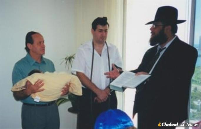 Bryn presides over the brit milah (circumcision) of Bella Itkina's grandson.