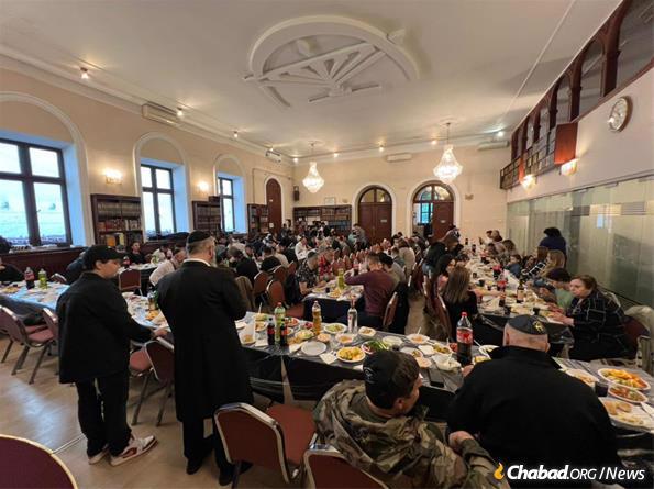 In Ukraine, Rabbi Avraham Wolf hosted hundreds at Chabad of Odessa for a sit-down lunch and bonfire.
